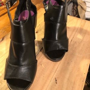 Black leather peekaboo style heels